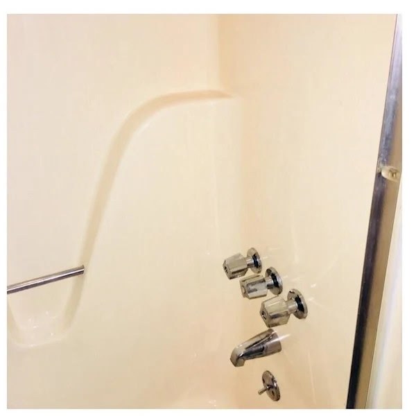 After: clean tub surround and fixtures