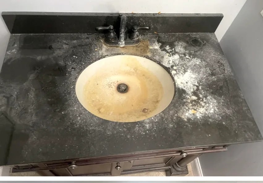 Before: mineral-caked bathroom vanity sink