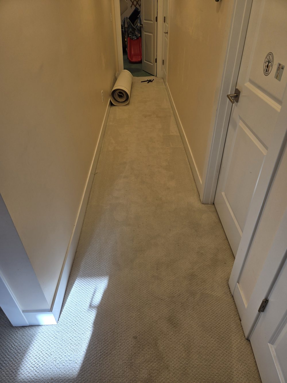 Before: hallway with old carpet