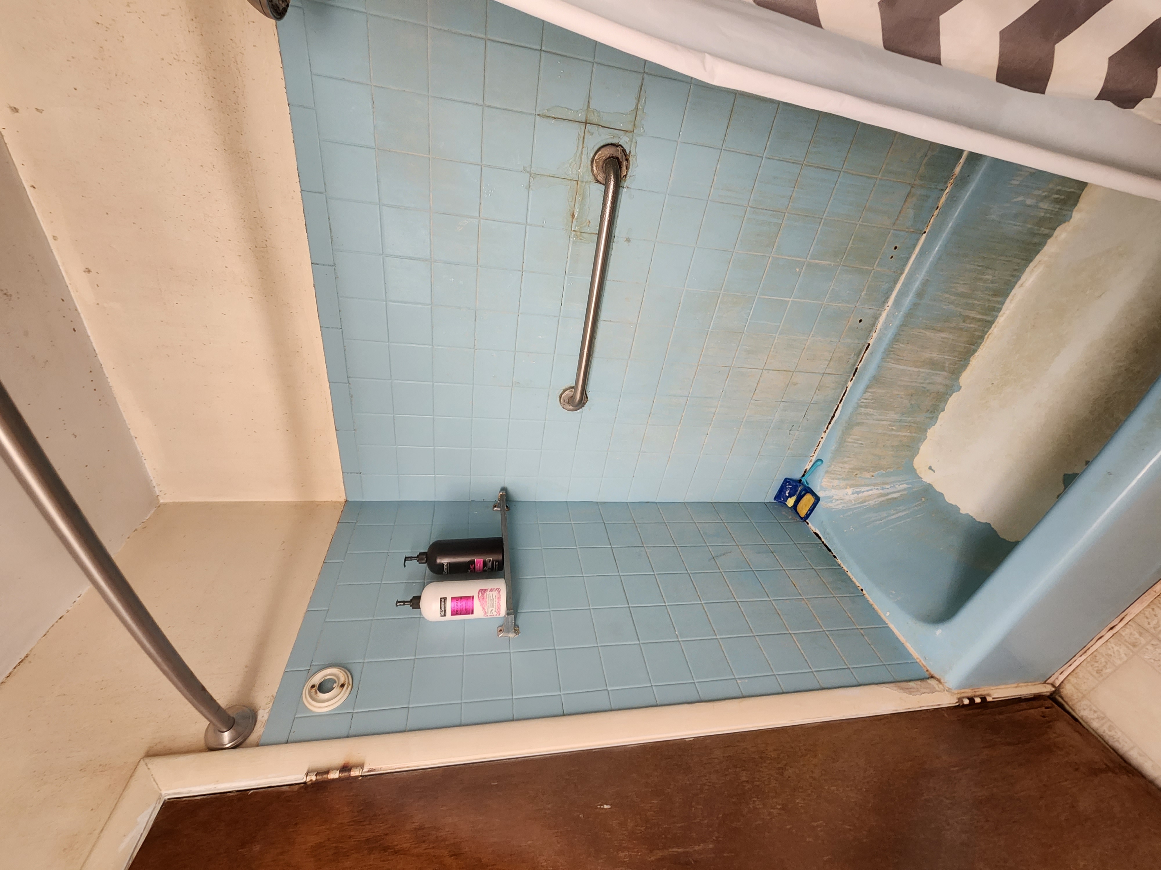 Before: worn bathroom shower and tub