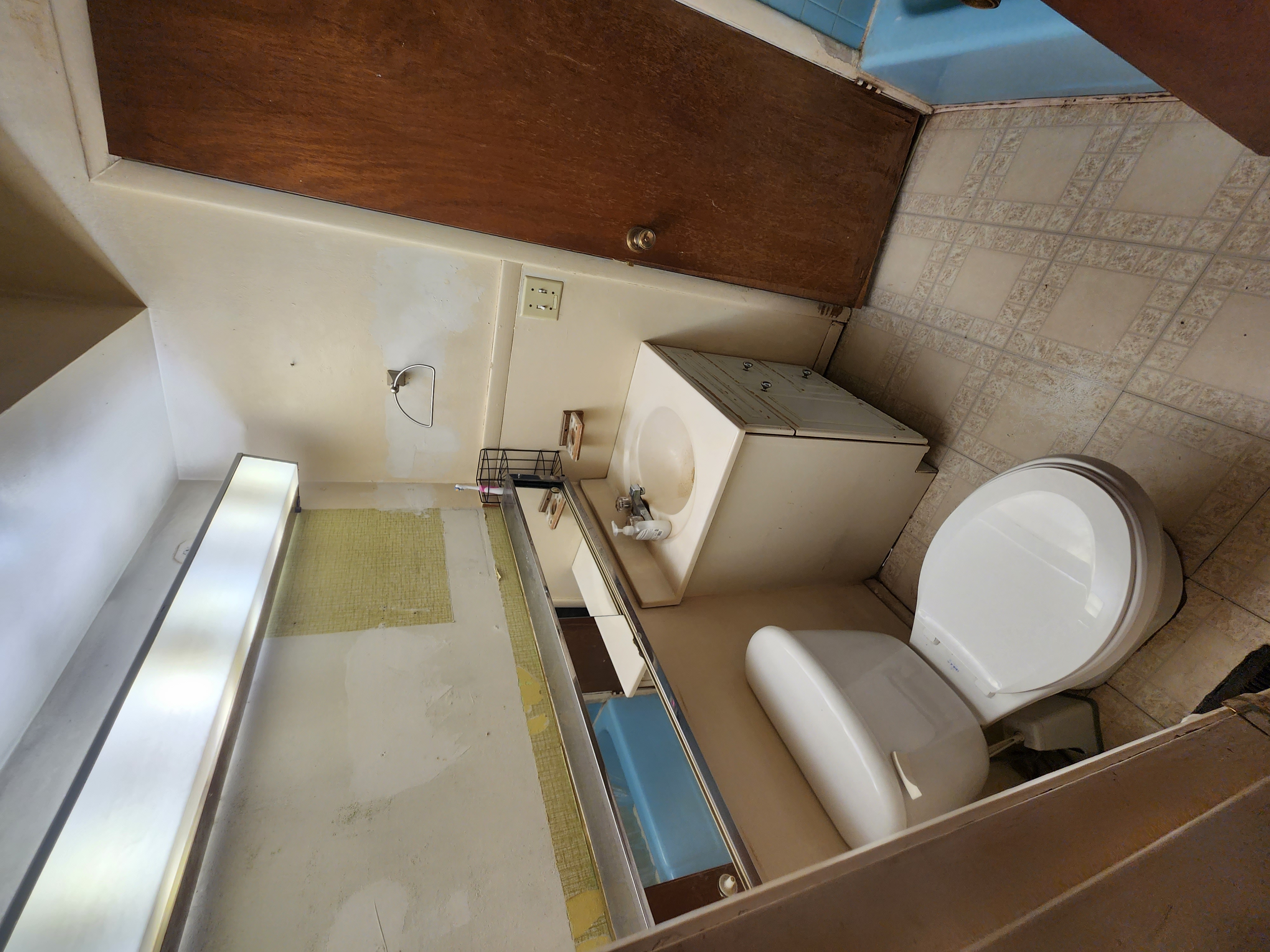 Before: toilet and vanity, close view