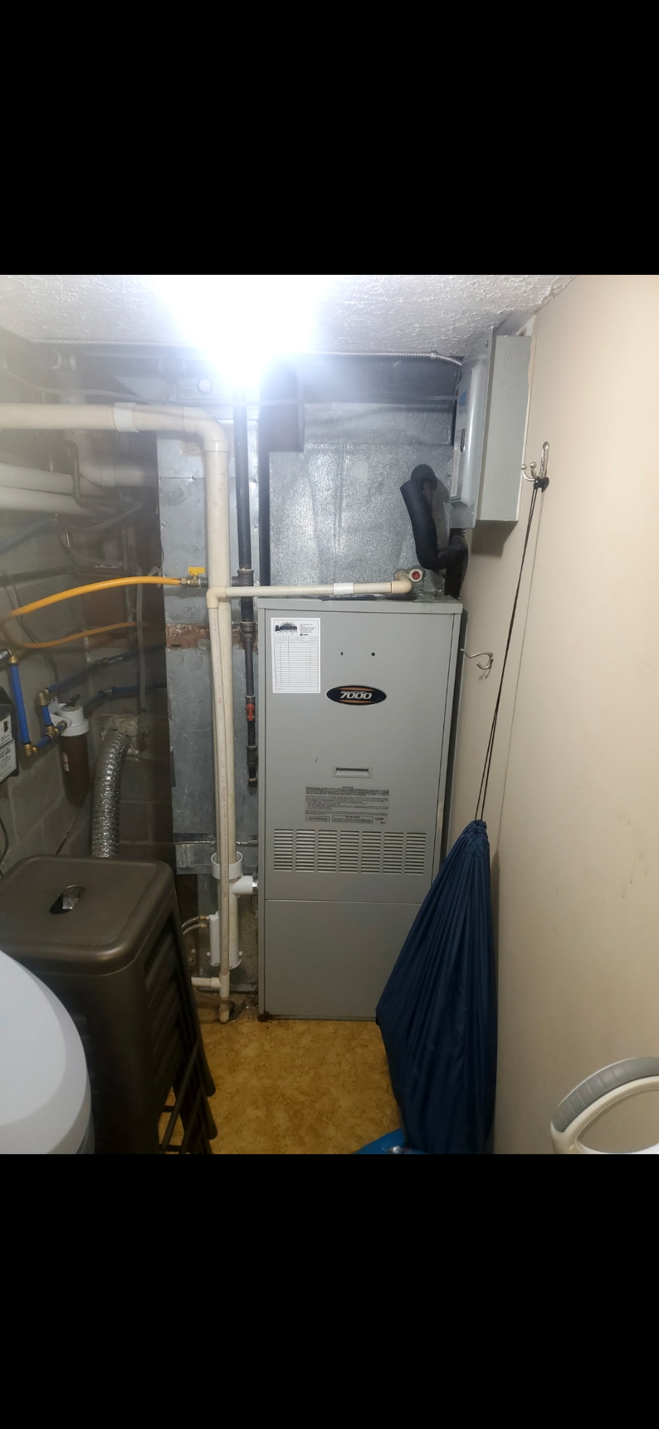 Before: old furnace and water heater setup