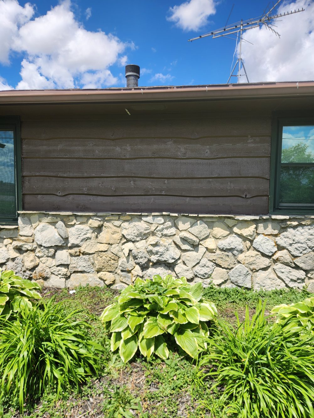 Before: worn wood siding, section 2
